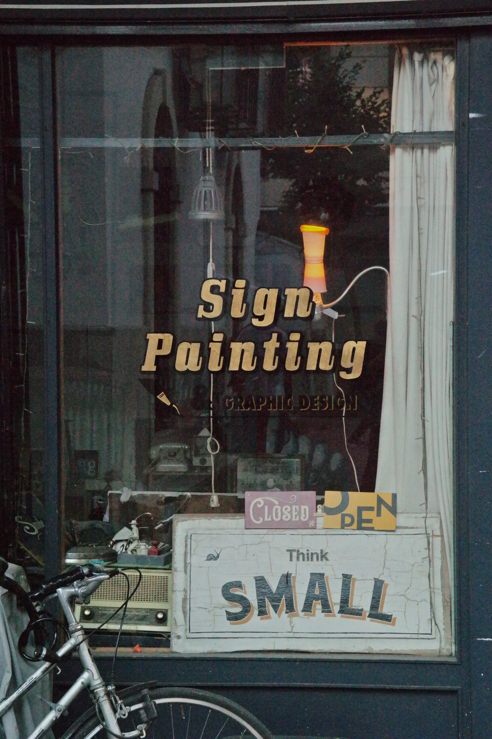 Shop front with professional window signage on a city street
