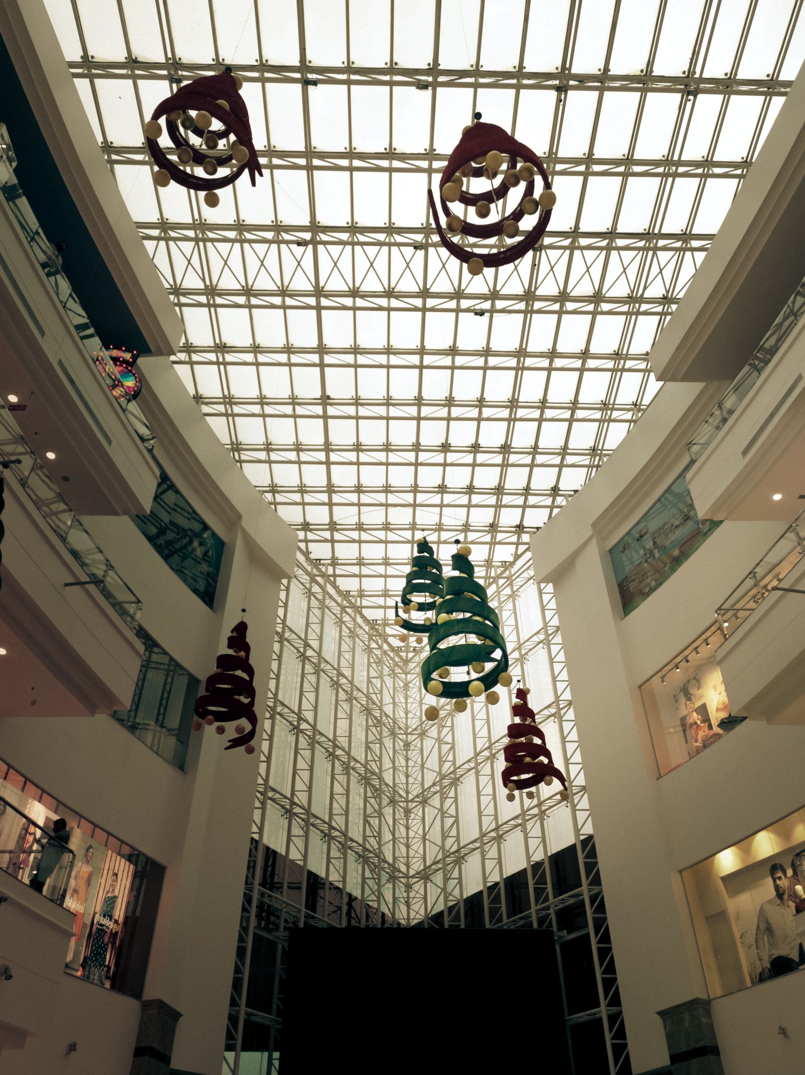 Seasonal decorations hanging from a shopping mall ceiling