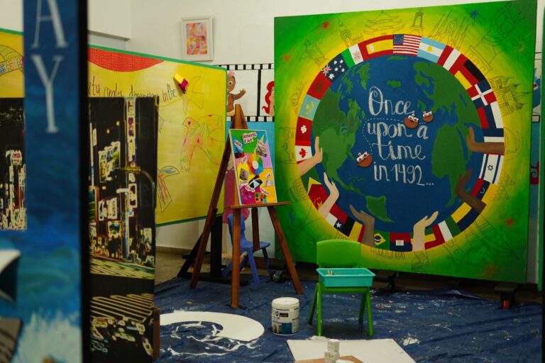 Colourful classroom with a world map wall mural