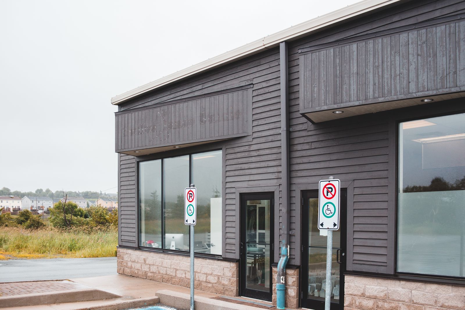 Contemporary commercial building exterior with glass doors