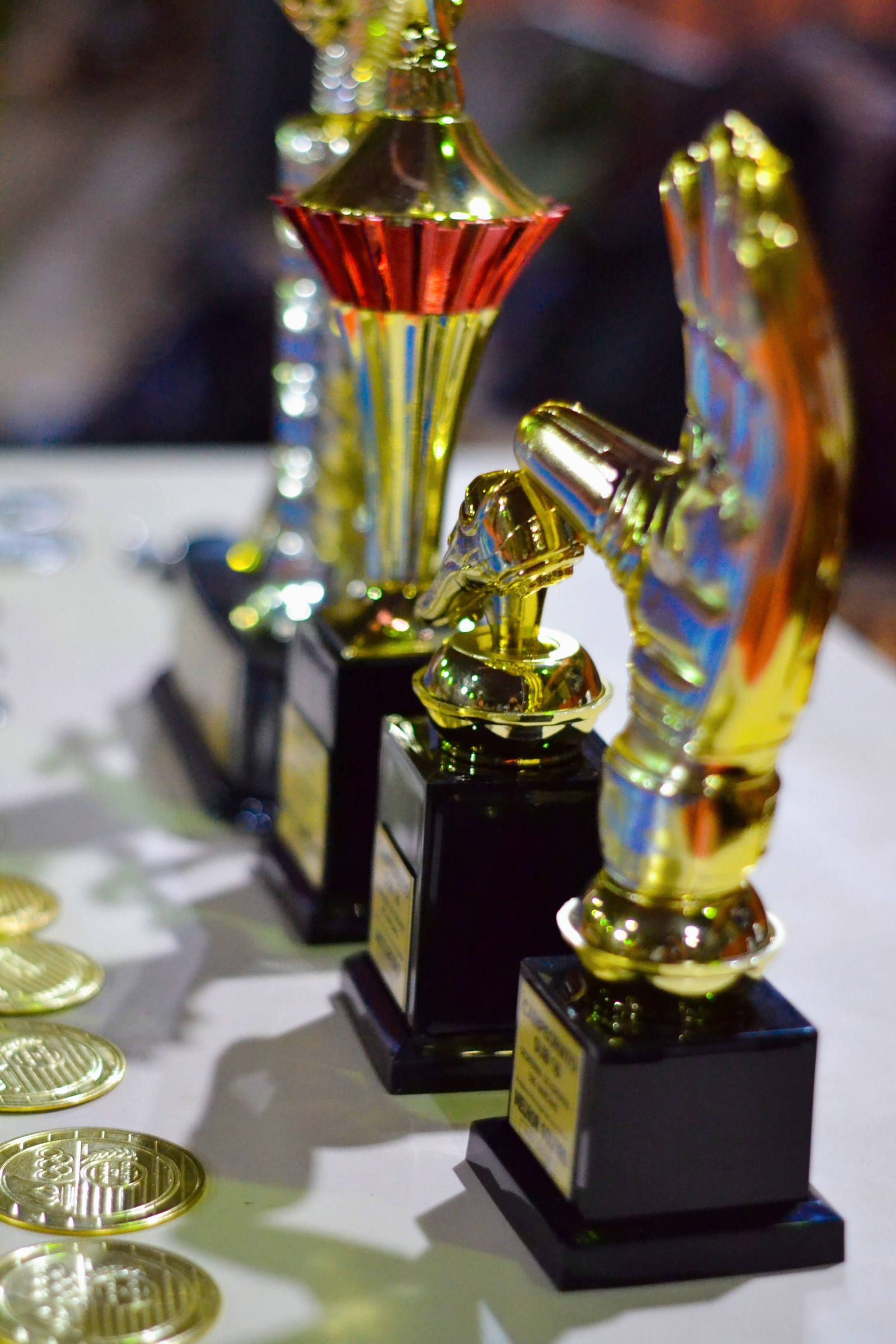 Golden trophies lined up ready for a school award ceremony
