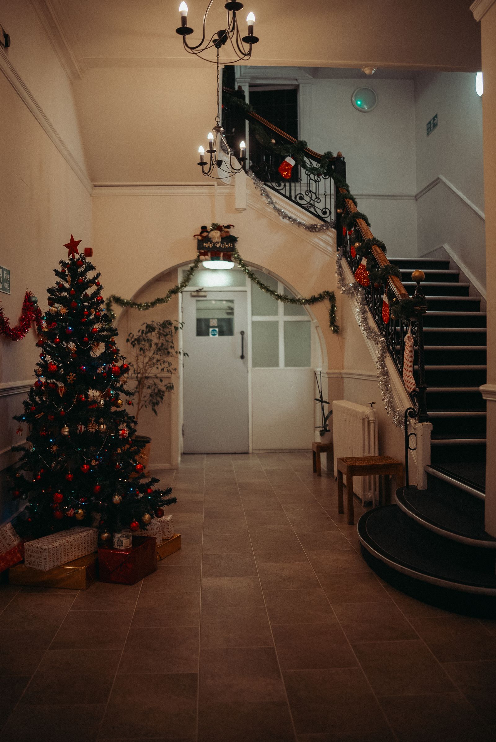 Hotel hallway with Christmas tree and tiled floor