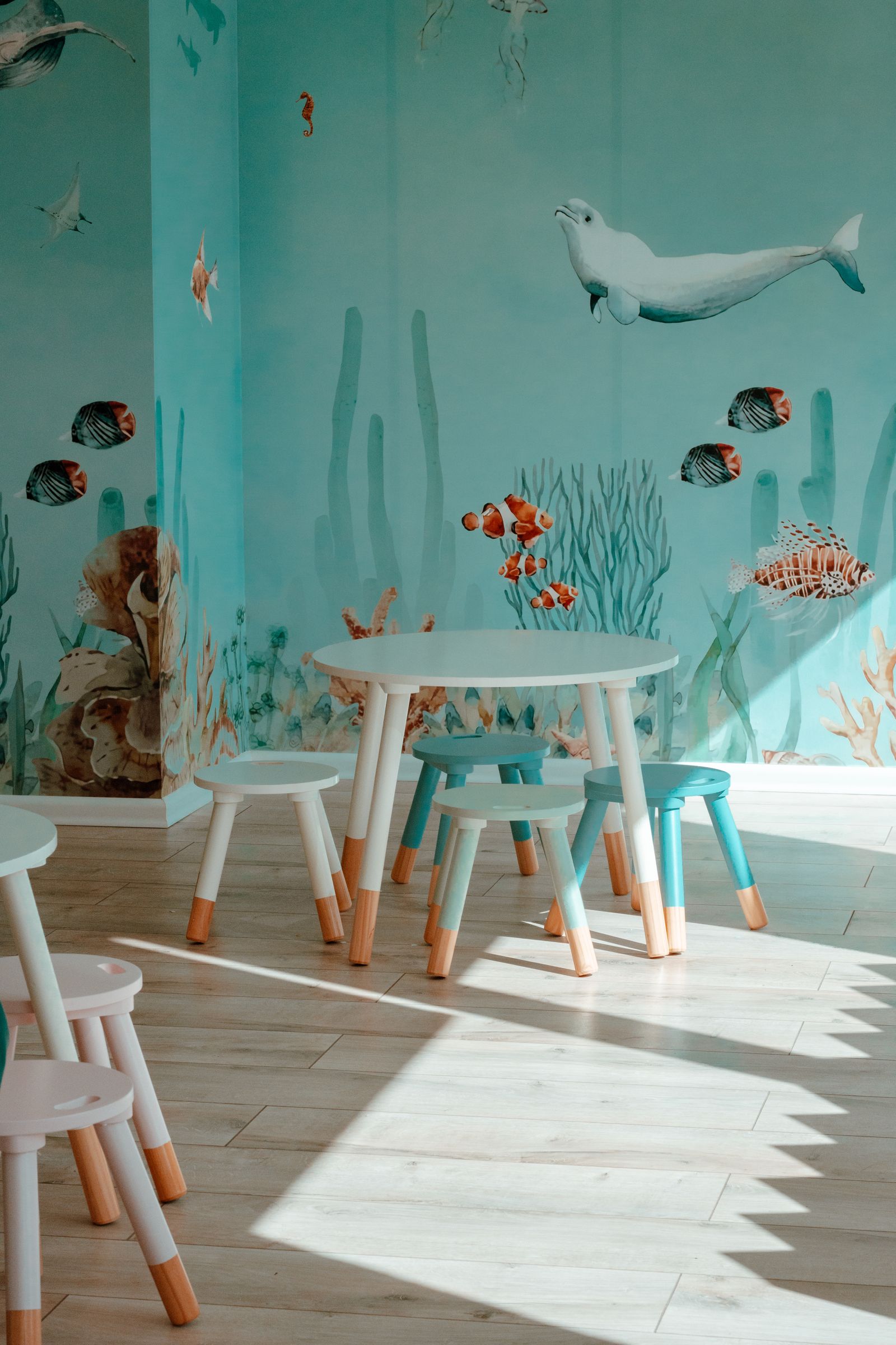 Kindergarten canteen with underwater themed wall mural