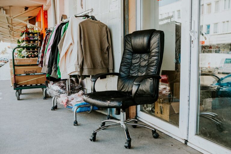 Secondhand shop exterior with a clothes rail on the pavement