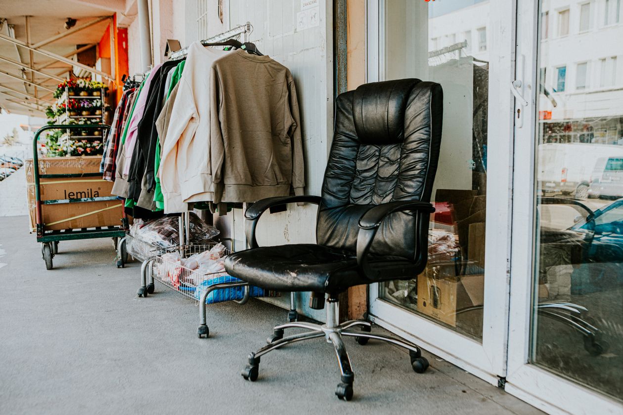 Secondhand shop exterior with a clothes rail on the pavement