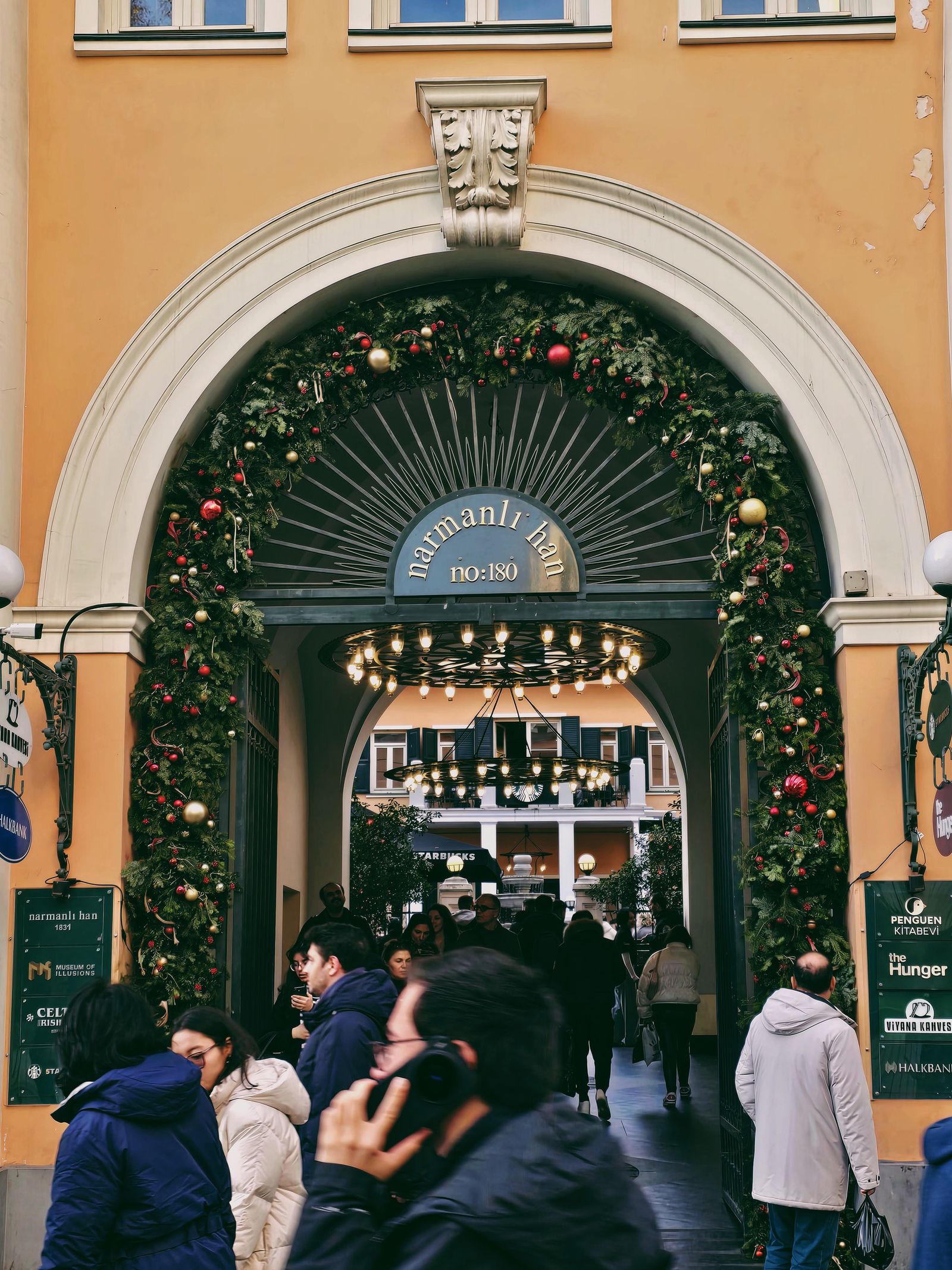Shopping arcade entrance decorated with festive garlands