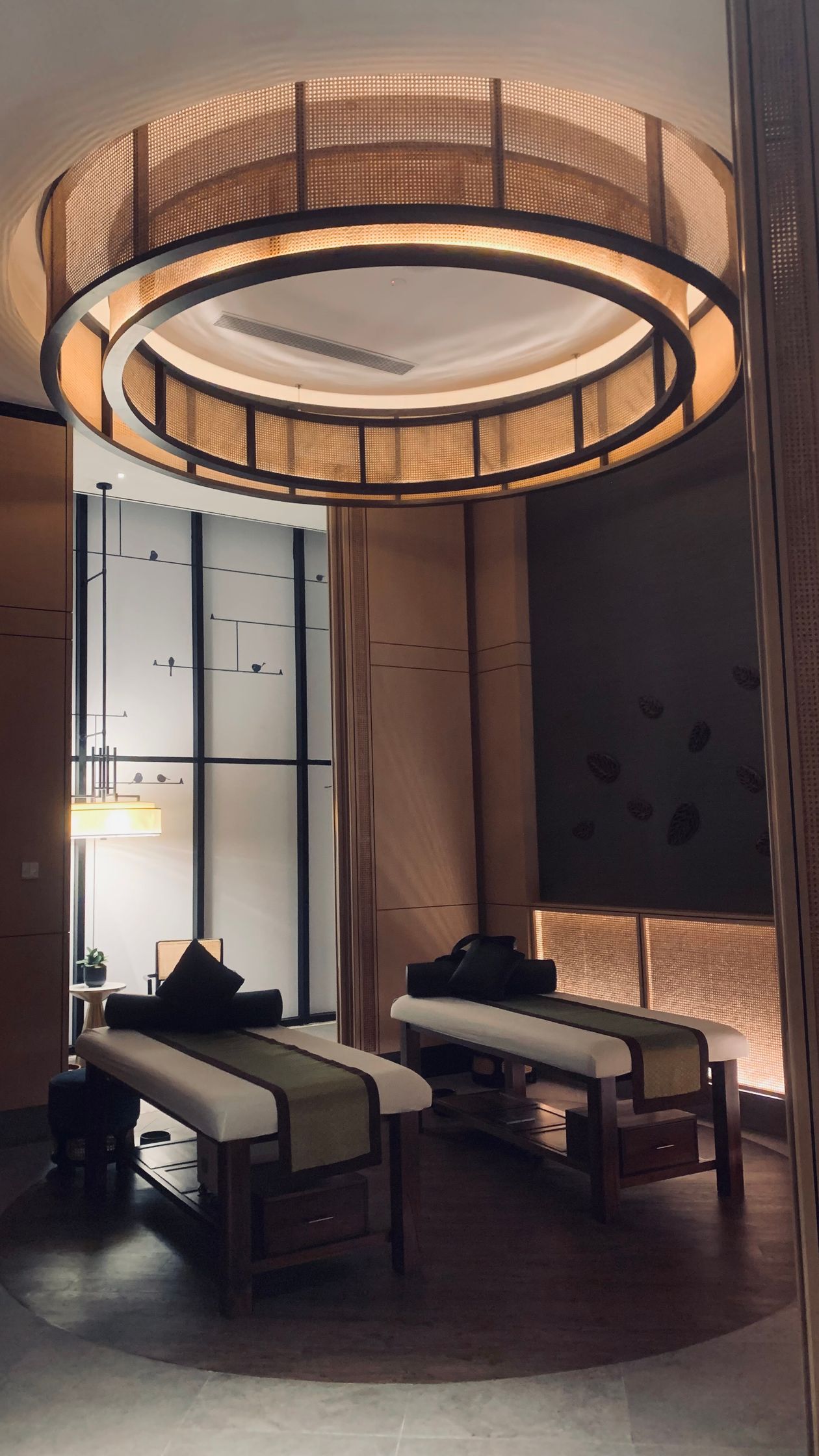 Spa treatment room with ambient lighting and seating