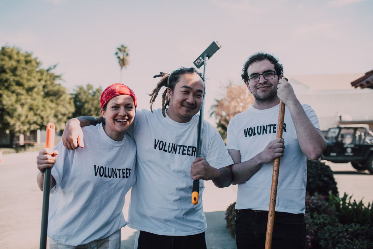 Volunteers in branded t-shirts at an outdoor community event