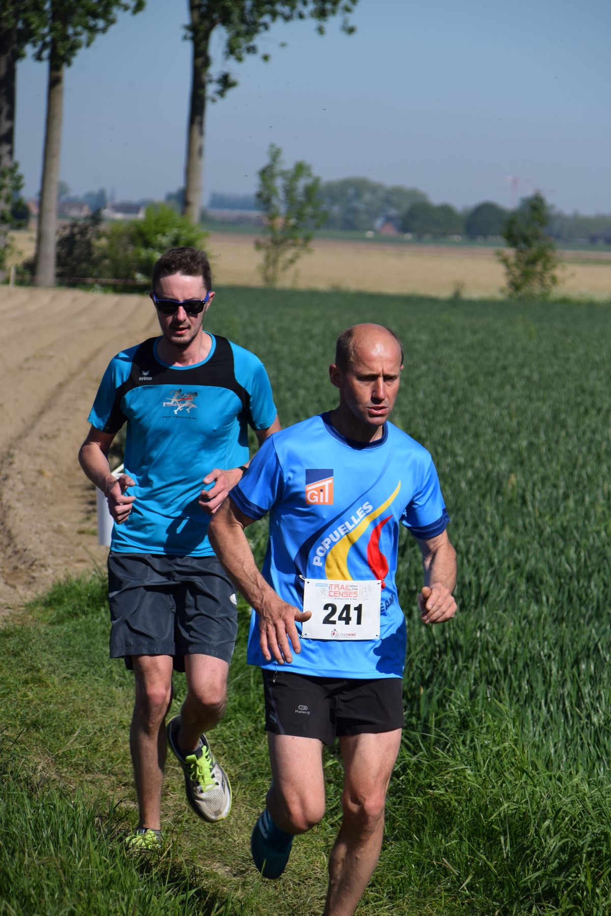 Runner wearing a numbered race bib during an outdoor race