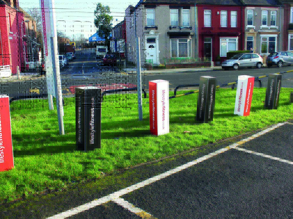 Branded bollard cover sleeves printed with a company logo along a kerbside